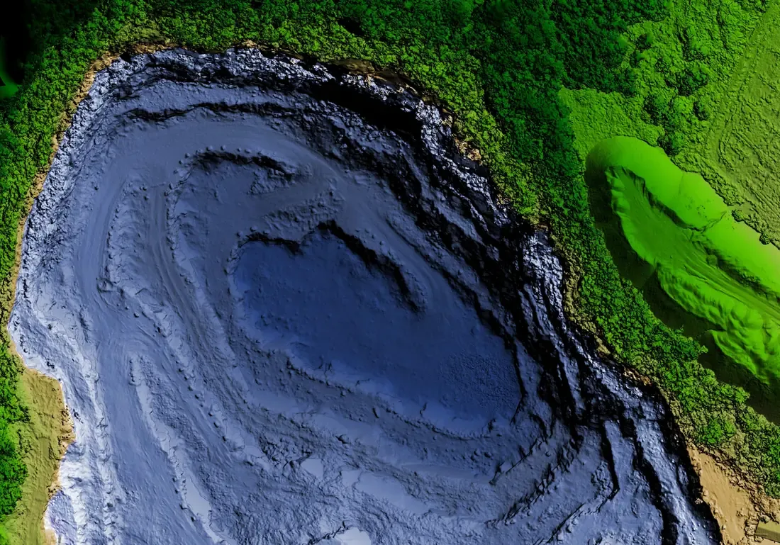 A LiDAR-derived elevation model of an open-cut mine, colour-ramped by height from pit floor to surrounding terrain